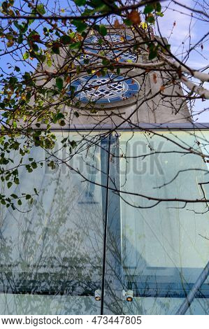 London - November 13, 2022: The Magnificent View Of The Oxo Tower Framed By The Branches Of The Tree
