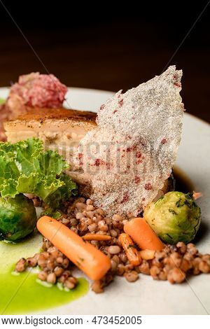 Close-up View On Dish Of Appetizing Piece Of Baked Meat With Buckwheat And Vegetables On Plate