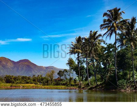 The Scenery Of Lake Against Mountains And Blue Sky In Garut, Indonesia.