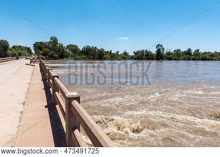 Grootdrink, South Africa - Feb 24, 2023: The Road Bridge Over A Flooded Orange River At Grootdrink I