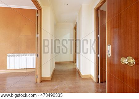 Entrance Hall Of A House With Laminated Flooring With Oak Woodwork Inside And Sapele Woodwork On The