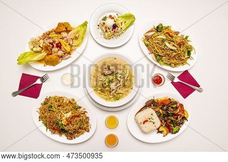 Selection Of Peruvian Food Dishes With Lomo Saltado With Rice, Chicken Broth, Hot Pepper, Lima Cause