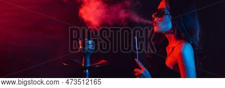 Hookah Atmosphere. The Girl Enjoys Smoking A Hookah, Sheesha. Place For Your Text.