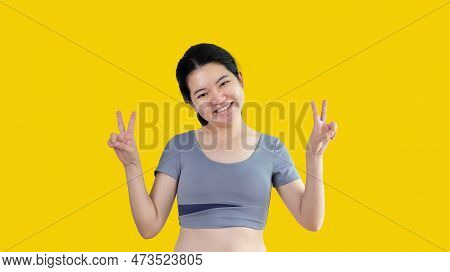 Young Asian Woman Making Two Thumbs Up Gesture Showing Joy And Fun, Symbol Of Good Friendship, Popul
