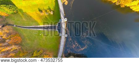 Fojtka Water Reservoir Surrounded By Vibrant Colored Forest At Autumn Time. Aerial View From Drone.
