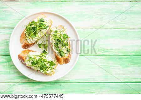 Open Sandwich With Cream Cheese And Micro Greens At Green Background. Natural Healthy Food, Natural 