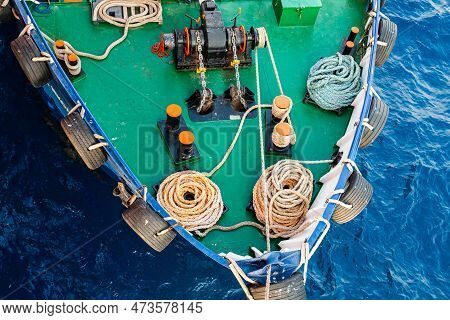 Front Of The Transport Ship On The Water, Top View. The Bow Of The Ship With An Anchor Winch, Ropes 