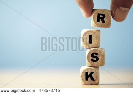 Hand Putting Risk Wording Print Screen On Wooden Block Cube For Financial Banking Risk Analysis And 