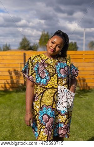Portrait Of Beautiful African American Woman Having Fun On Village Or Suburbian. Outdoor Portrait Of
