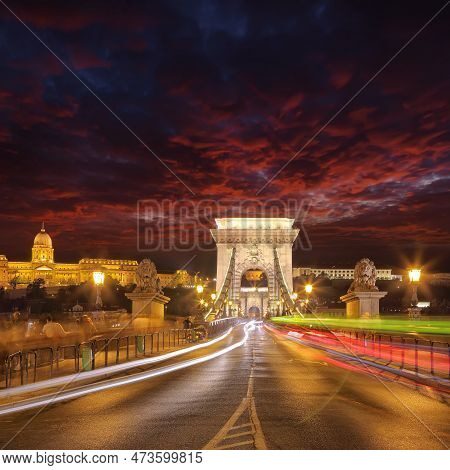 Amazing Night Scene With Traffic On Széchenyi Chain Bridge Over Danube River. Location: Budapest Cit