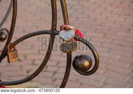 It Is Written There A Wish For A Happy Family Life. Several Padlocks On An Iron Structure