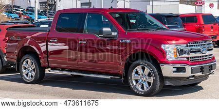 Monroeville, Pennsylvania, Usa March 26, 2023 A Red Ford F150 Four Door Pickup Truck For Sale At A D