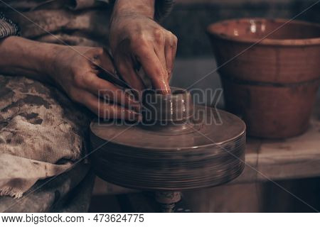 Modeling Bowl From Clay On Wheel In Pottery Workshop. Dirty Hands Of Craftsman Mold Crockery. Techni