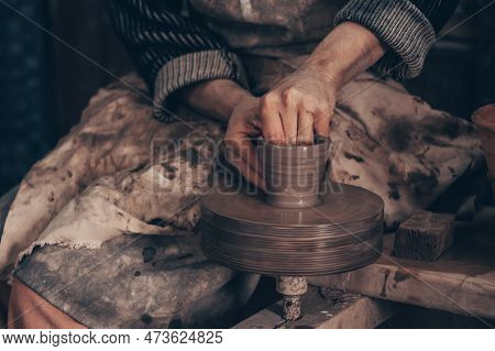 Modeling Bowl From Clay On Wheel In Pottery Workshop. Dirty Hands Of Craftsman Mold Crockery. Techni