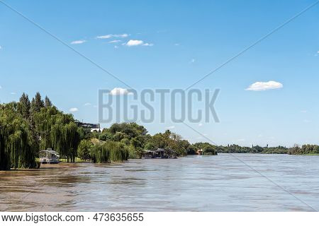 Upington, South Africa - Feb 24, 2023: A Sightseeing Boat And A Floating Restaurant Deck On The Bank
