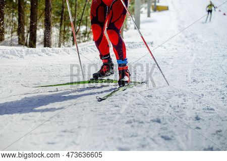 Zlatoust, Russia - March 17 2019: Skier Athlete Running Uphill In Skiing Competition, Fischer Racing