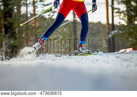 Zlatoust, Russia - March 17 2019: Male Skier Running Uphill In Cross-country Skiing, Fischer Racing 
