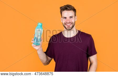 Helps Skin Glow. Handsome Young Man With Fit Body Drinking Fresh Water. Thirsty Fitness Male Enjoyin