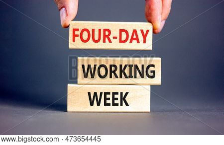 Four-day Working Week Symbol. Concept Words Four-day Working Week On Wooden Block On A Beautiful Gre