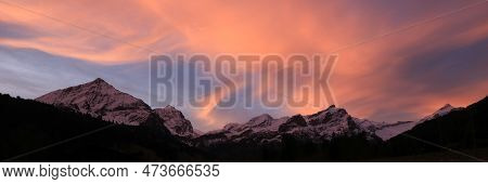 Colorful Morning Sky Over A Mountain Range In Gsteig Bei Gstaad.