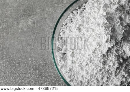 Petri Dish With Calcium Carbonate Powder On Light Grey Table, Closeup. Space For Text