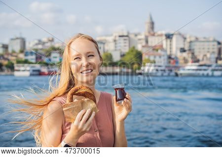 Woman In Istanbul Having Breakfast With Simit And A Glass Of Turkish Tea. Glass Of Turkish Tea And B