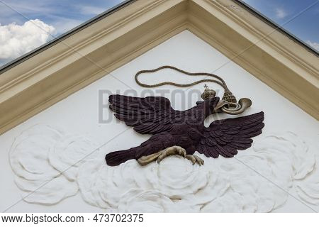 Melk, Austria - February 24, 2023: Relief Presenting Eagle With A Post Trumpet In Its Beakon Fasade 