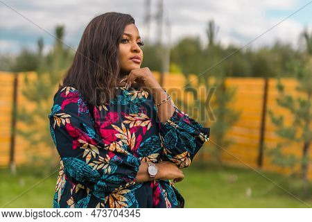 Portrait Of Beautiful African American Woman Having Fun On Village Or Suburbian. Outdoor Portrait Of