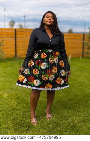 Portrait Of Beautiful African American Woman Having Fun On Village Or Suburbian. Outdoor Portrait Of