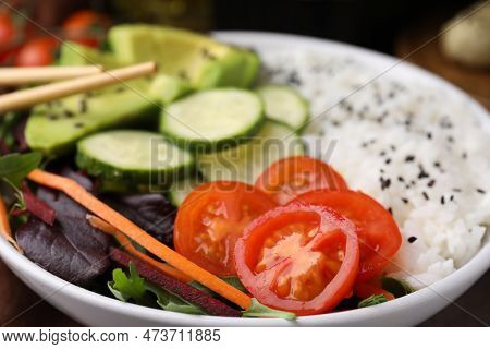 Delicious Poke Bowl With Vegetables, Avocado And Mesclun, Closeup