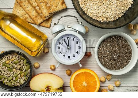Diet Time. Food Clock. Healthy Eating With Oat Flakes, Hazelnuts, Chia Seeds, Pumpkin Seeds, Sunflow