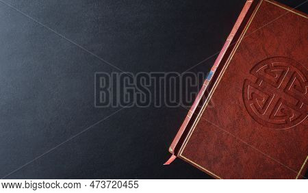 Shenista Culture And Religion Book With Religious Symbol Engraved On The Brown Leather Cover On A Bl