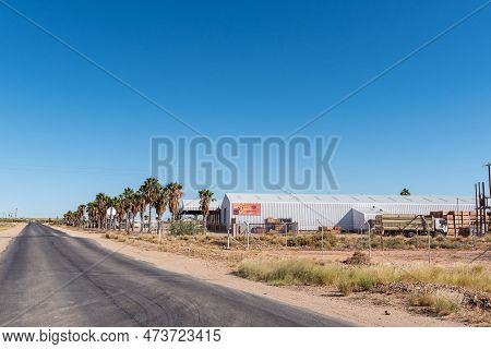 Kanoneiland, South Africa - Feb 25, 2023: A Road Scene, With A Raisin Depot, Near Kononeiland. Many 