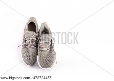 Gray Sneakers On A White Background. Gray Casual Sports Shoes. Mens Sneakers For Sports. Fabric Summ