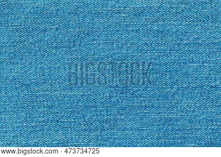 Top View Of Denim Jeans Texture Background. Canvas Blue Denim Cloth Fabric Textile Use As Background