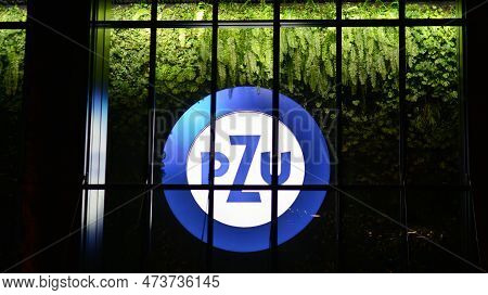 Warsaw, Poland. 29 March 2023. Signboard Of The Insurance Company Pzu On A Glass Facade Of A Modern 