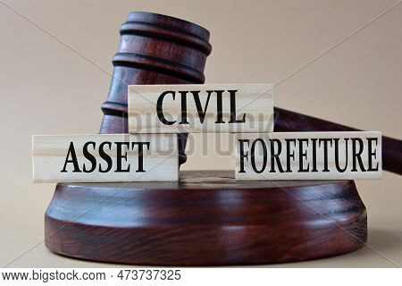 Civil Asset Forfeiture - Words On Wooden Blocks Against The Background Of A Judge's Gavel With A Sta