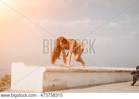 Woman Summer Dance. Silhouette Of A Happy Woman Who Dances, Spins And Raises Her Hands To The Sky. A