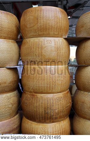 Cremona, Italy - September 7, 2022: Whole Wheels Of Parmigiano Reggiano Cheese Sold At A Street Stal