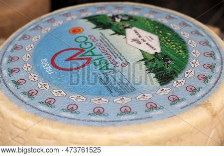 Cremona, Italy - September 7, 2022: Whole Wheels Of Asiago Cheese Sold At A Street Stall During The 