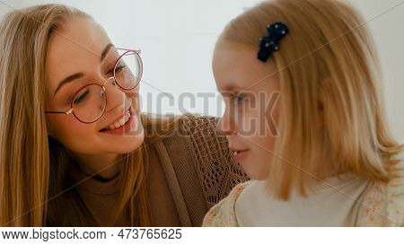 Close Up Loving Caucasian Mom Mother In Glasses Talking To Little 6s Daughter Speaking Together Indo