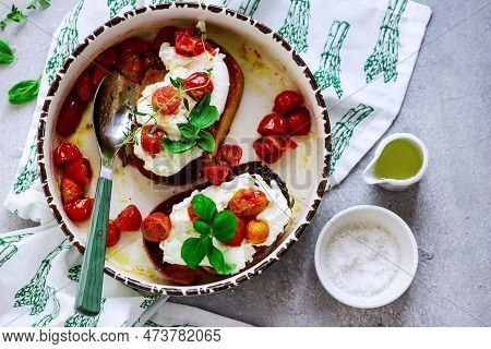 Bruschetta With Buratta And Baked Cherry Tomatoes.top View.selective Focus