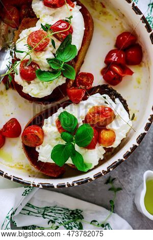 Bruschetta With Buratta And Baked Cherry Tomatoes.top View.selective Focus