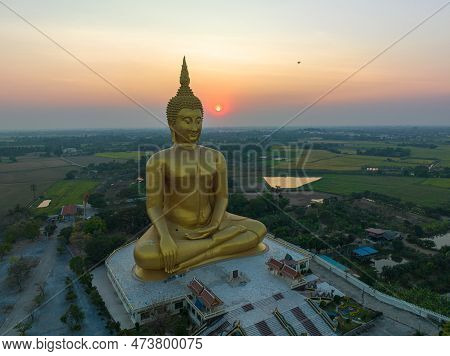 Scenery Sunset Behind The Great Golden Buddha Landmark Of Thailand At Wat Muang Ang Thong Thailand. 