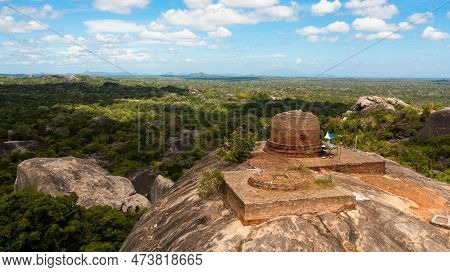 Kudumbigala Monastery Complex On Rock And Jungle Against Blue Sky And Clouds. Sri Lanka, Okanda.