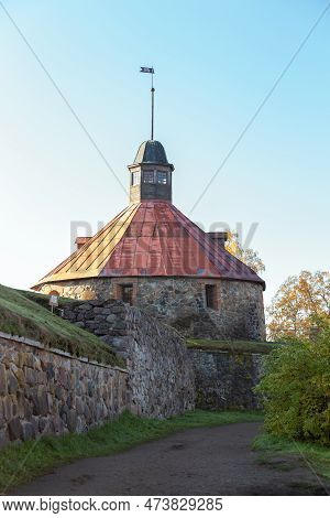 Korela Fortress In Priozersk, Russia. Stone Tower On The Background Of Blue Sky. Autumn Landscape Wi