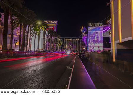 Beautiful View Of Out-of-focus Strip Road Tracers. Night View Of Las Vegas Cityscape With Defocused 