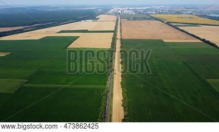 Beautiful Panoramic View Of Many Agricultural Fields With Different Agricultural Green Plants And Ri