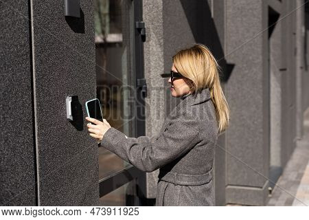 Smart Home Concept - Close Up Of Woman Use Mobile Phone To Open Electronic Lock