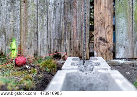 The Foundation Of The House Is Made Of Concrete Blocks Bound With Metal Armature